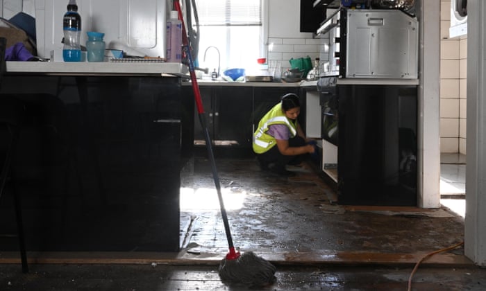 Clean up at a property on Edward Street in Camden on Friday as flood recovery starts.