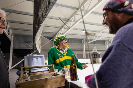 Opponents Russell ‘Rusty’ Nevill (L) and Brett (R) take a break for a shot of whiskey and a catch up during the Jerry Sanders knockout tournament where teams from the Idaburn Curling Council play against each other for a 2.5 hour game of outdoor (crampit) curling.