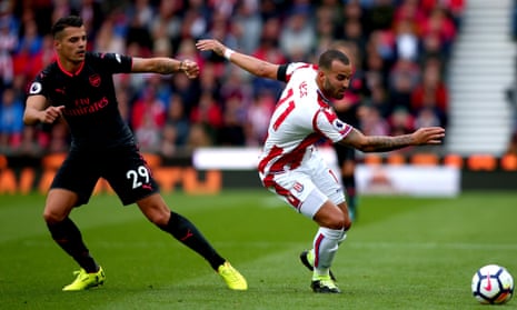 The Arsenal midfielder Granit Xhaka, left, failed to track Jesé Rodríguez, right, leading to Stoke’s winner