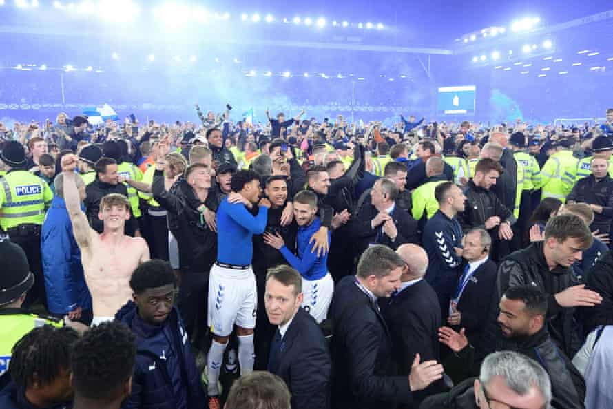 Everton’s Anthony Gordon (left), Reece Welch, Lewis Dobbin and Jonjoe Kenny (centre together) amongst the joyous Toffee fans after their victory over Crystal Palace ensured their Premier League survival.