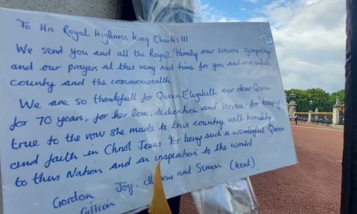 One of the many tributes pinned to the railings of Buckingham Palace in honor of Queen Elizabeth II.