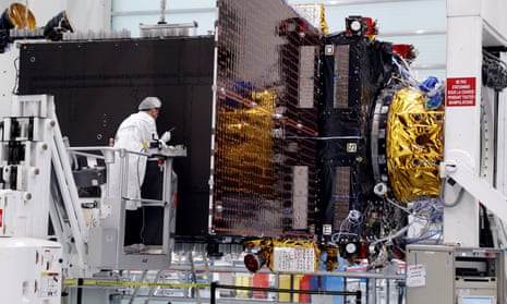 Technicians work on the Inmarsat S-Band/Hellas Sat 3 satellite in the clean room facilities of the Thales Alenia Space plant in Cannes, France, in 2017