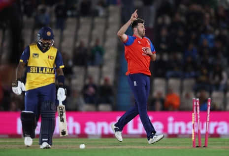 England's Jamie Overton celebrates the wicket of Sri Lanka's Wanindu Hasaranga.