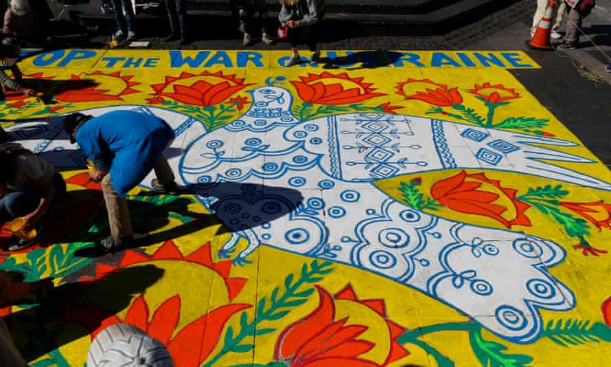 Her spirit survives … a rally for peace in San Francisco, recreating a work by Prymachenko called A Dove Has Spread Her Wings and Asks for Peace.