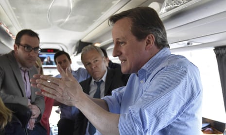 David Cameron speaks with journalists on Conservative Party ‘battle bus’.