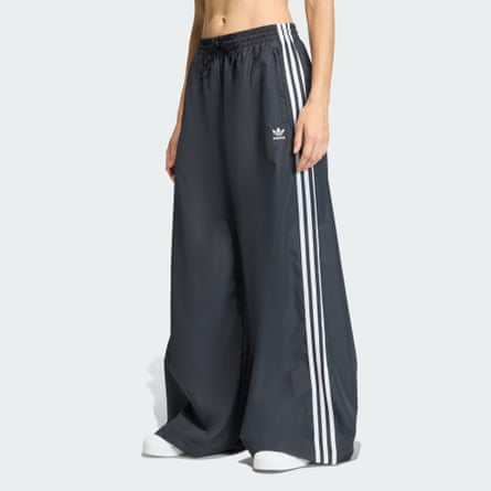 person wearing baggy black track pants