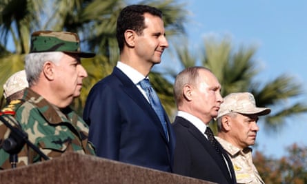 Vladimir Putin standing shoulder to shoulder with Syrian president Bashar al-Assad