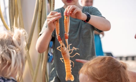 A family at the island’s summer langoustine festival