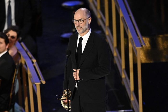 Screenwriter Jesse Armstrong accepts the award for best writing in a drama series for Succession.