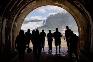 Ontario, Canada. People make their way through a century-old tunnel after a ceremony to mark its opening as a tourist attraction at the Niagara Parks power station in Niagara Falls