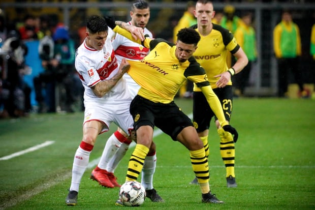 Stuttgart’s Steven Zuber, left, battles for possession with Borussia Dortmund’s Jadon Sancho during a recent Bundesliga fixture.