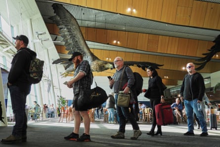 Passengers wait to board a flight at Wellington Airport below the sculpture of an eagle from the Hobbit films, in Wellington, New Zealand, Monday, 5 May 2025.