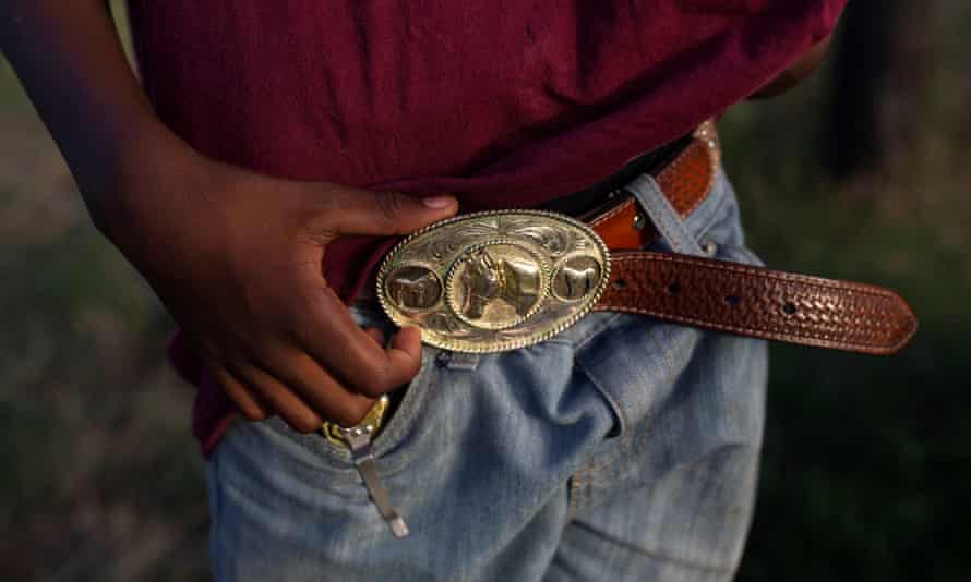Tre’shon Brown holds his horse belt at the trail ride in Calvert.