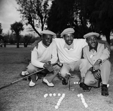 Ted Rhodes, Eural Clark and Charles Sifford pose with golf balls arranged in the shape of ‘71’.