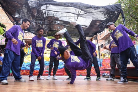 A local breakdancing group perform for tourists