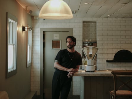 Luciano Valdivia, restaurateur and former president of the Rhinebeck chamber of commerce, leaning against a worktop in a kitchen