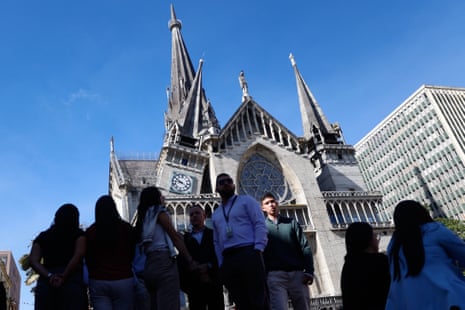 Residents stand outside the Cathedral of Manizales after it was damaged by an earthquake in Manizales, Colombia, Monday, Aug. 10, 2026.