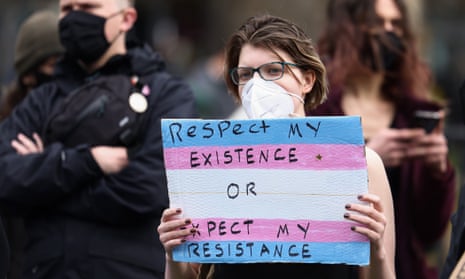 Protester holding a sign saying 'Respect my existence or expect my resistance'