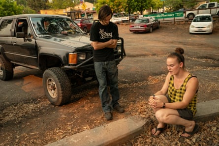Katherine Champion and her friend Chris Dawson sit at the parking lot in Forestville.