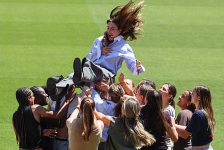 The Barcelona midfielder Alexia Putellas is thrown in the air by her teammates during a ceremony at Camp Nou to mark her leaving the club.