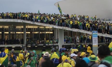 Supporters of former President Jair Bolsonaro clash with security forces as they raid the National Congress in Brasília, Brazil, 8 January 2023.