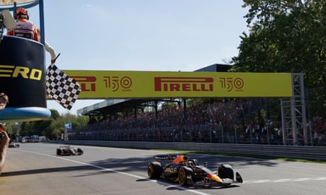 Max Verstappen takes the chequered flag.
