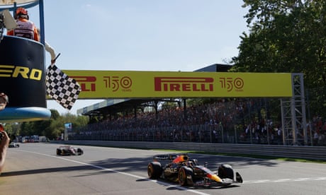 Max Verstappen takes the chequered flag.