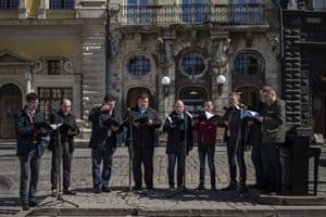 Members of a choir sing during a concert organised by the Lviv National Philharmonic in downtown Lviv, on Tuesday