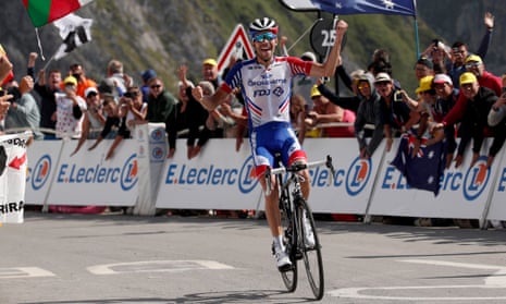 Thibaut Pinot celebrates his win as he crosses the finish line.