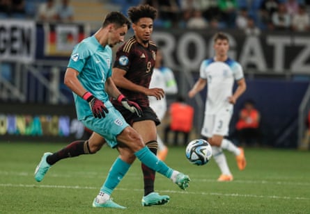 James Trafford passes the ball under pressure from Germany's Kevin Schade