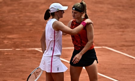 Iga Swiatek and Karolina Muchova embrace after a back-and-forth classic in the French Open final.