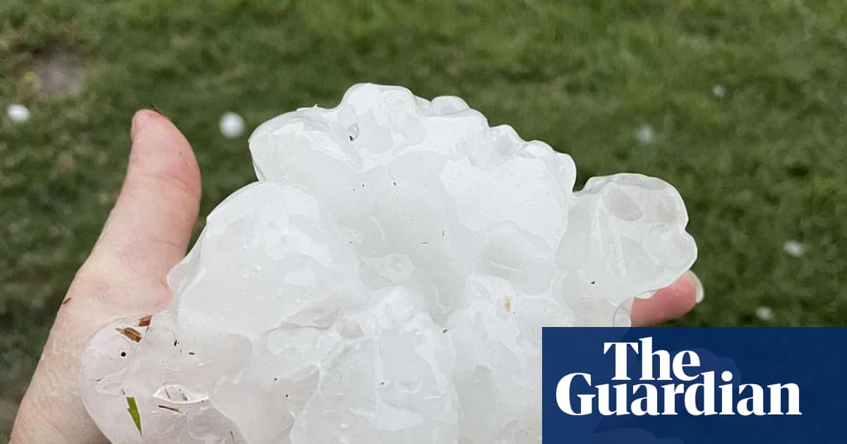 Brisbane battered by ‘giant hail’ as severe thunderstorms leave thousands in Queensland with power outages