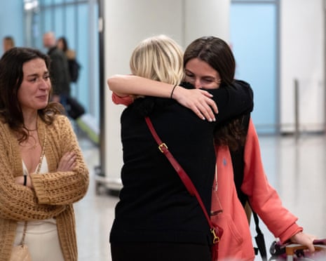A passenger of the first charter flight carrying 127 Italians stranded in Oman or transiting from the UAE to Oman is welcomed after arriving at Fiumicino airport in Rome