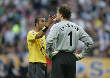 Ashley Cole consoles Jens Lehmann.