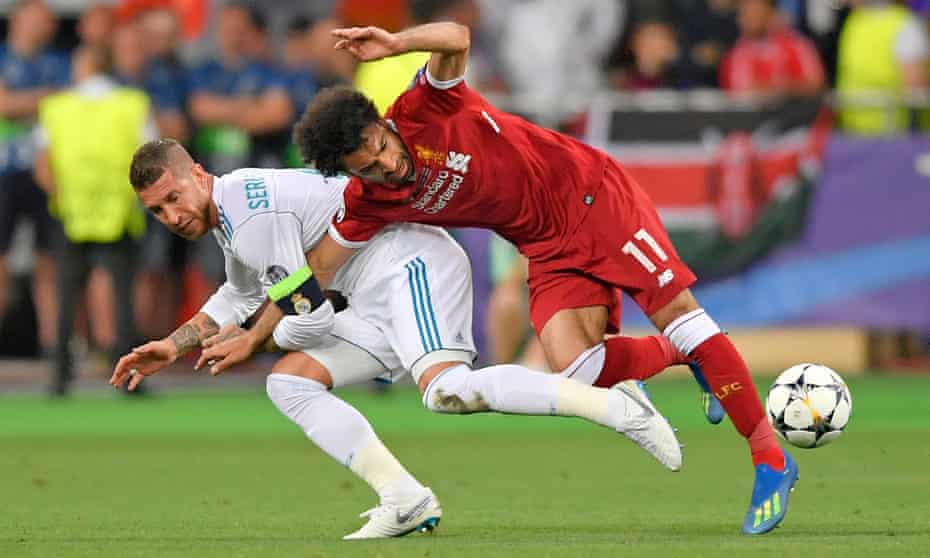 Liverpool’s Mohamed Salah is pulled to the ground by Sergio Ramos during the 2018 Champions League final
