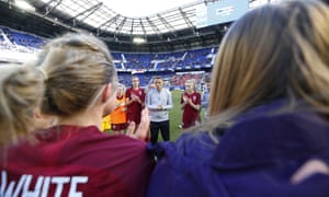 Phil Neville speaks to his players after the match.
