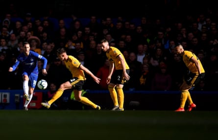 Chelsea’s Eden Hazard finds a route past three Wolves players.