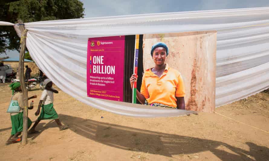 A banner in Nigeria with a picture of a young woman smiling