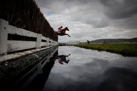 Myretown, ridden by Patrick Wadge, leaps over the water jump en route to victory in the Ultima Handicap Steeplechase on day one of the Cheltenham Festival.