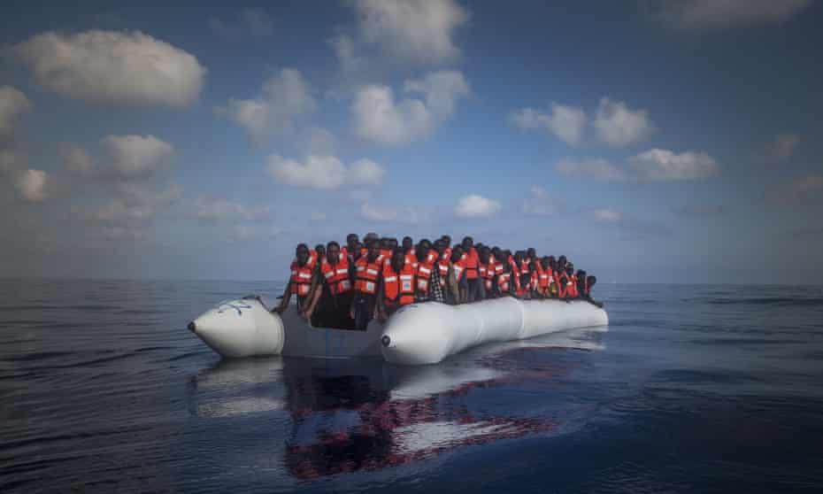 About 150 refugees and migrants wait for help during a rescue operation on the Mediterranean Sea off Libya.