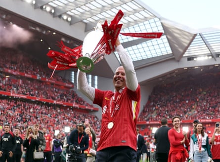 Arne Slot lifts the Premier League trophy in 2025.