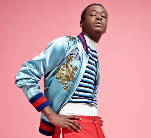 Ashton Sanders, star of Moonlight film, against a pink background