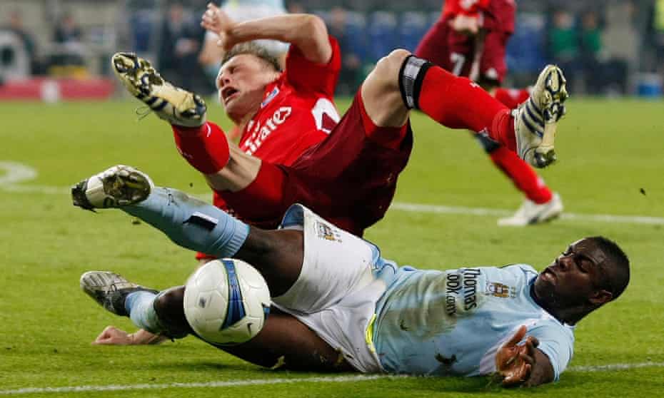 Micah Richards tackles Hamburg SV’s Ivica Olic during Manchester City’s Uefa Cup quarter-final match in April 2009 9, 2009.