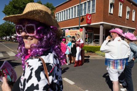 Nikolaas Kostraby and Juanita Kottek posing with festivalgoers at the Kissing Booth