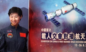 Chinese astronaut Liu Yang of the Tiangong-1 mission poses for photographs during the opening ceremony of an exhibition on China’s first space station in 2012.