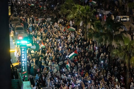 Thousands of Moroccan protesters are pictured in a street in Casablanca as they take part in a demonstration in solidarity with Palestinians.
