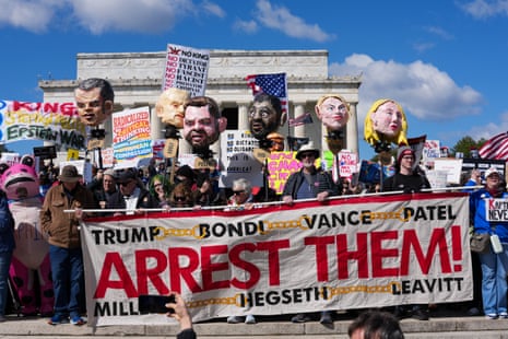 Demonstrators hold effigies of Trump administration officials as they gather at the Lincoln Memorial during the "No Kings" national day of protest in Washington, DC, on March 28, 2026.