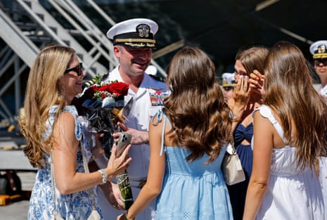 Captain Dan Keeler, the USS Abraham Lincoln’s commanding officer, met family members after the returned to San Diego following an extended deployment to launch strikes on Iran.