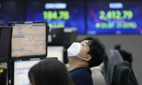 A currency trader at the foreign exchange dealing room of the KEB Hana Bank headquarters in Seoul, South Korea.