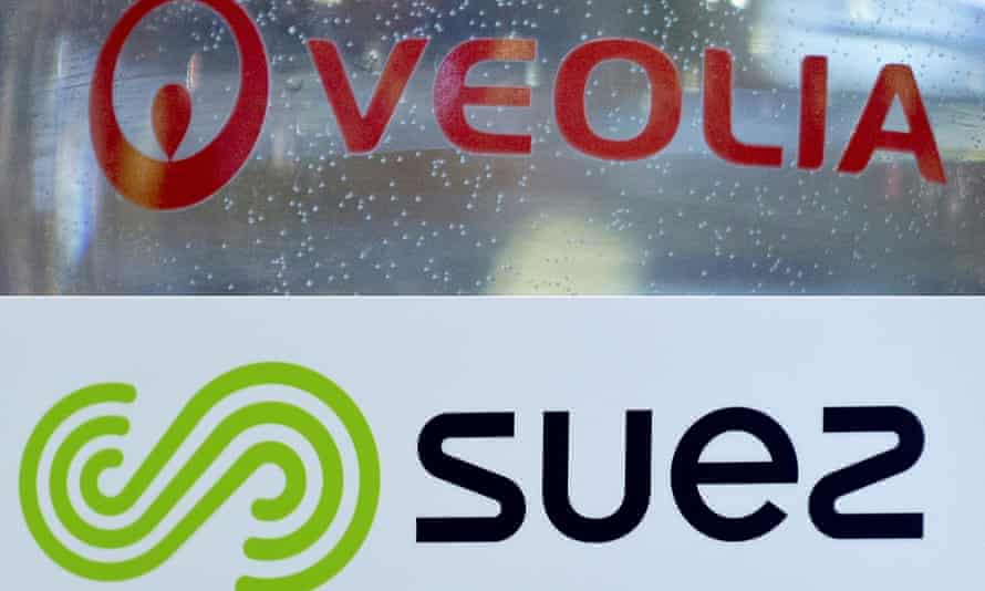 The logos of French utility groups Veolia Environnement and Suez.